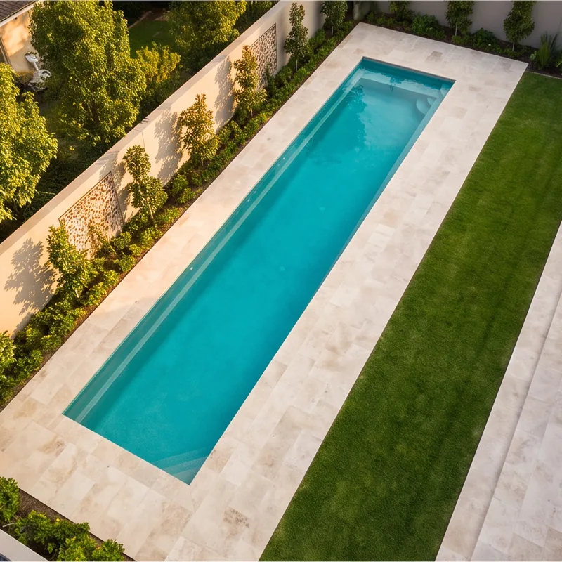 Long narrow lap pool along a garden wall